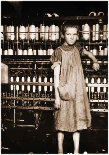 Photo of a little girl working in a textile plant, taken in the US in the early 20th century.