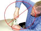 Incorrect posture sitting for Handtool use.