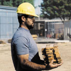 Laborer holding 10 lbs. of wood close to body