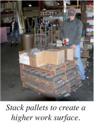 Stack pallets to create a higher work surface