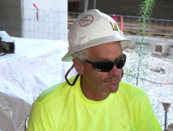 Man wearing wide brimmed hat and sunglasses