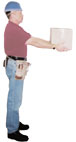 Carpenter holding a 10 lb box close to his body