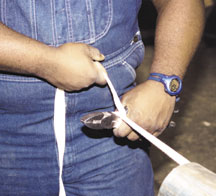 Carpenter using a scaffold to work on high area