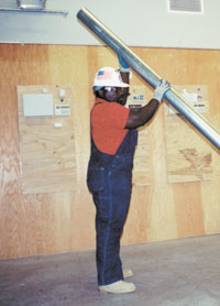 Carpenter using a cart to transport materials