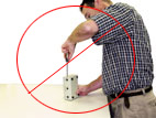 Incorrect posture standing for Handtool use..