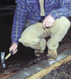 Carpenter swinging a hammer