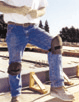 Carpenter wearing knee pads