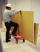 Carpenter using a cart to transport materials