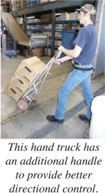 This hand truck has an additional handle to provide better directional control