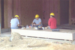 3 guys taking a break in the shade