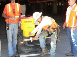 Man getting water from water container