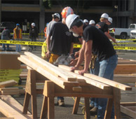 2 people working using power tools