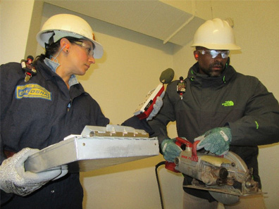 Cal/OSHA engineer with a construction worker.